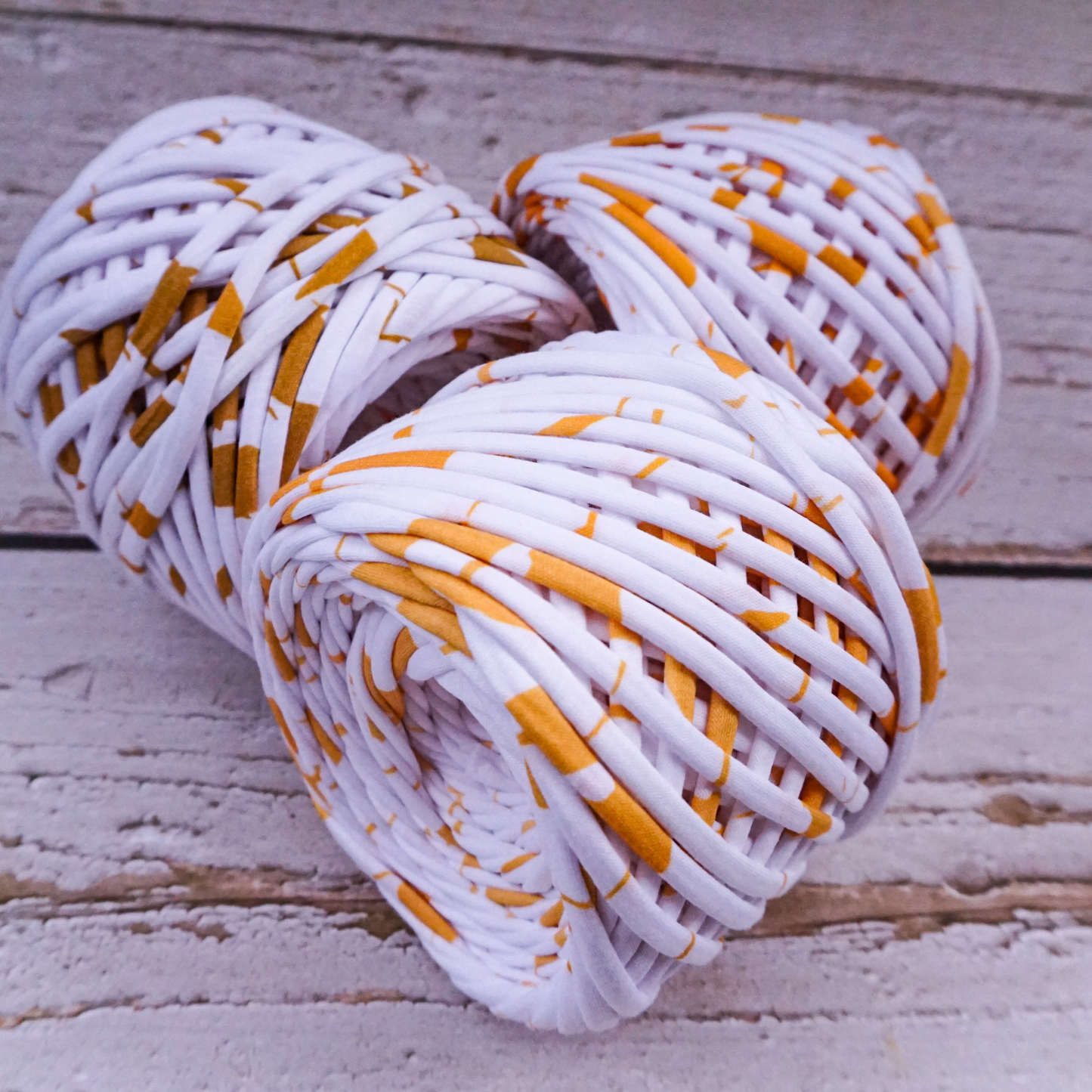 T-shirt yarn for crocheting baskets, bags, rugs and home decor. White with gold strokes