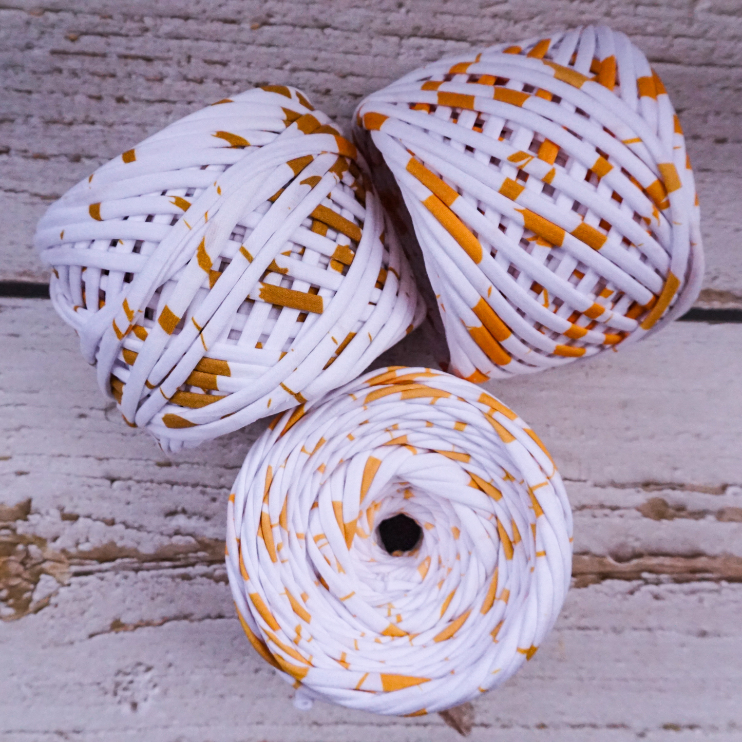 T-shirt yarn for crocheting baskets, bags, rugs and home decor. White with gold strokes